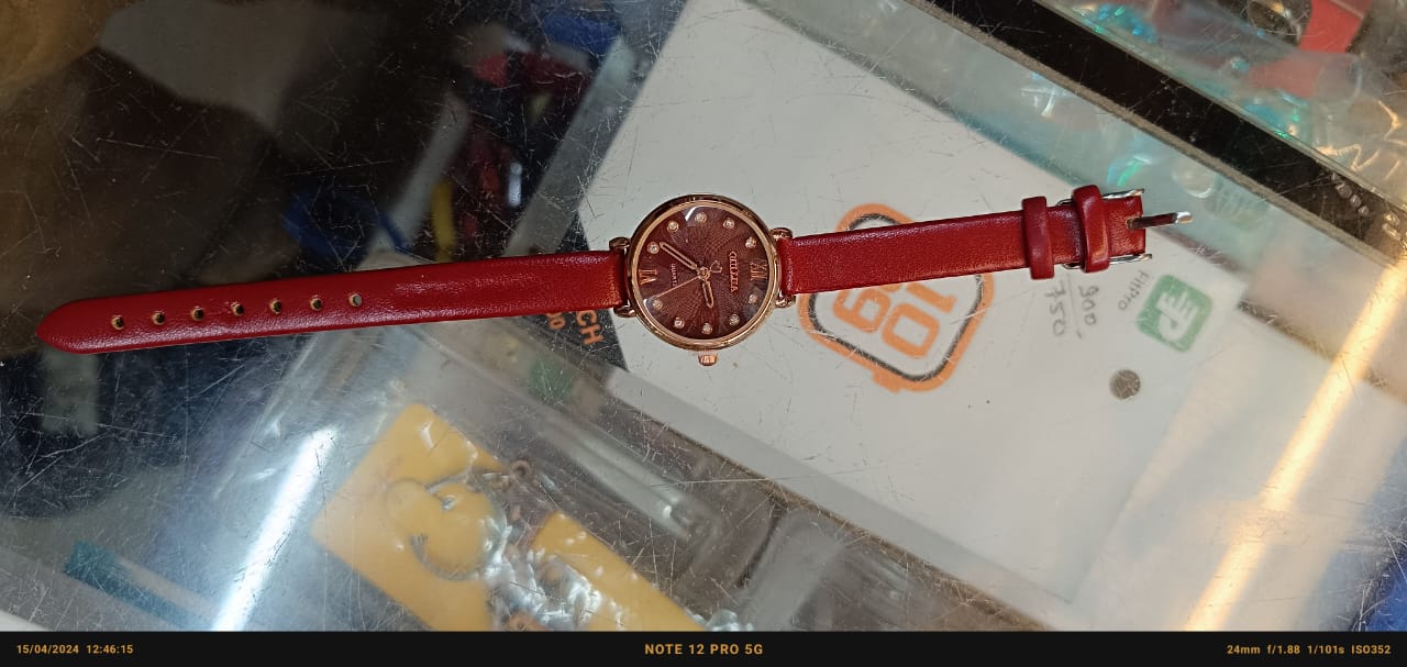 "Elegance in Motion: Quartz Round Dial cherry Strap Ladies Watch with Gold Accents"